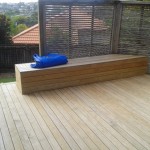 Deck with seat and trellis fence