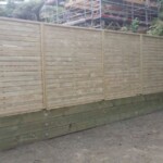 Trellis fence on retaining wall 1 Trellis fence on retaining wall 1